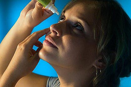 Woman Putting in Eye Drops 1